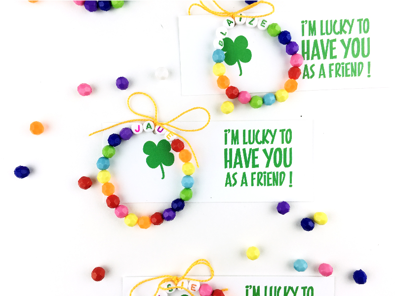 St. Patrick's Day DIY Bracelet | Come learn how to make this easy DIY rainbow bracelet for St. Paddy's day and download your free printable to give as a fun little gift! 