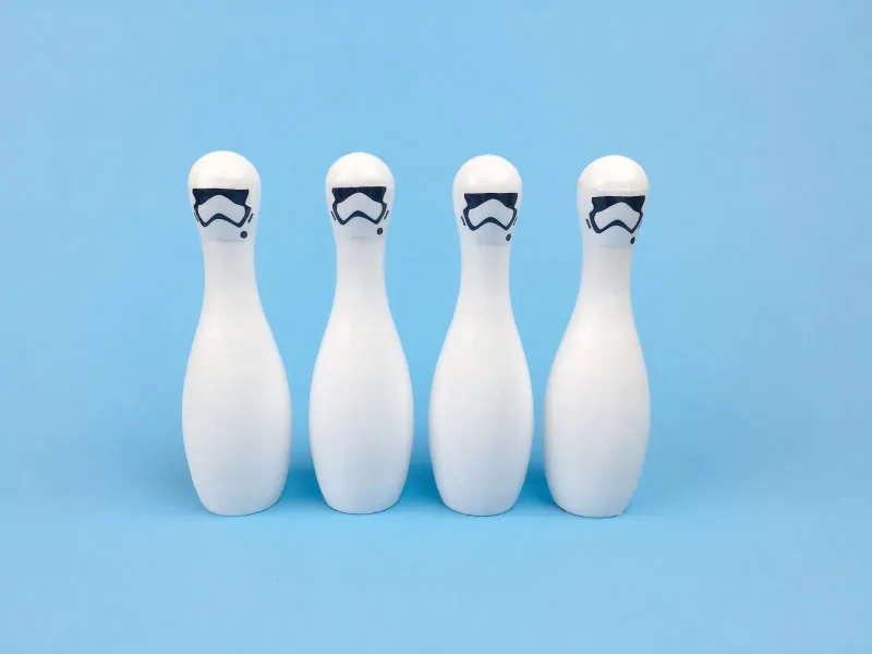 Star Wars DIY Bowling Set | Awaken the force within your child and give them a fun game to play with over and over again. Click through to download the free printable stormtrooper faces and make this fun toy today! 