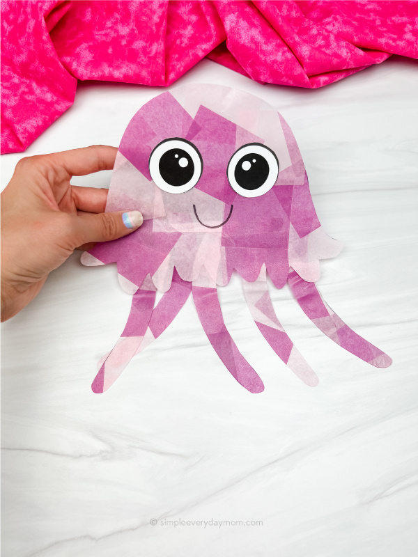 hand holding jellyfish suncatcher craft