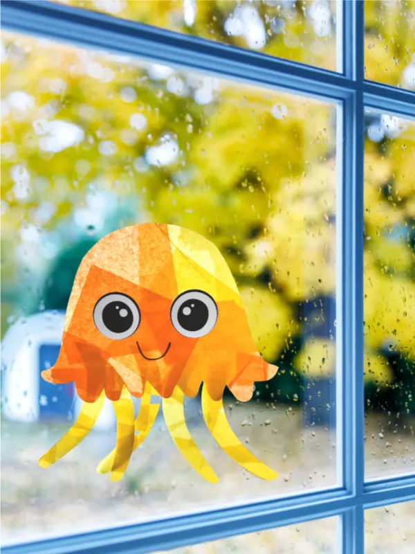 orange and yellow jellyfish suncatcher craft hanging in window