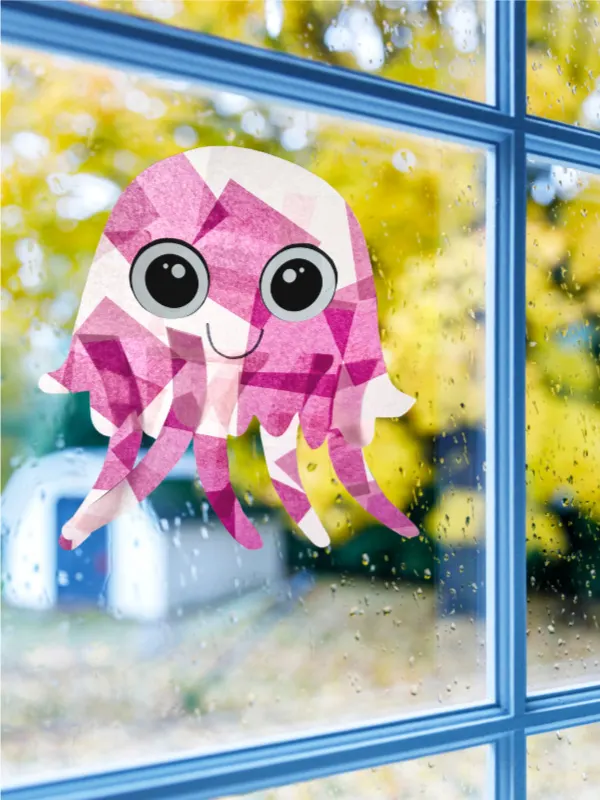 purple and pink jellyfish suncatcher craft hanging in window