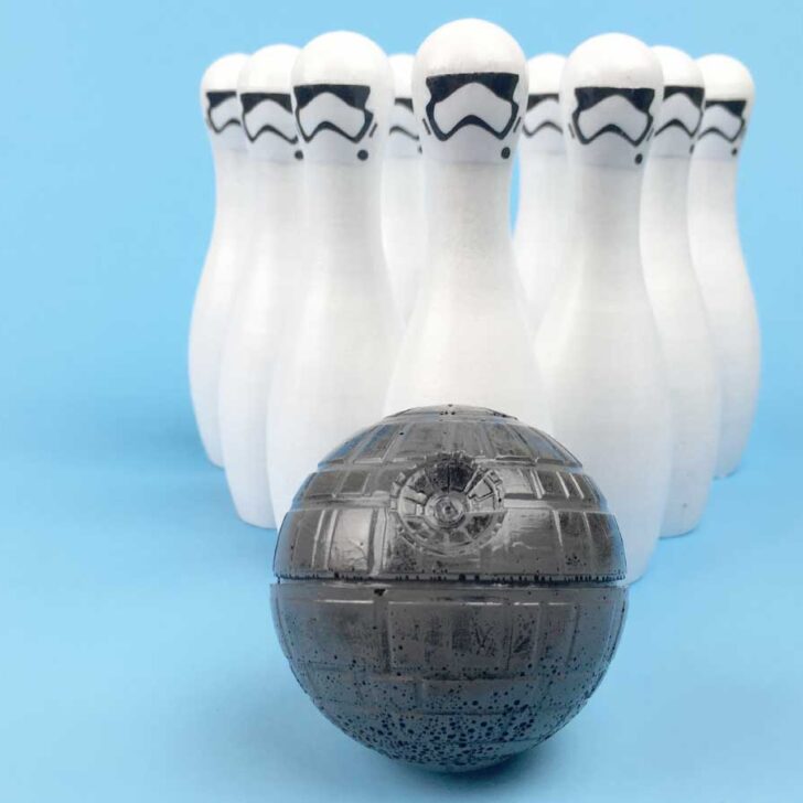 Star Wars DIY Bowling Set | Awaken the force within your child and give them a fun game to play with over and over again. Click through to download the free printable stormtrooper faces and make this fun toy today!