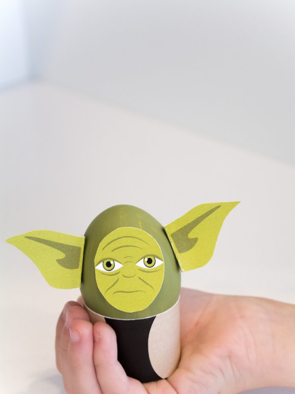 child hand holding Yoda Easter egg