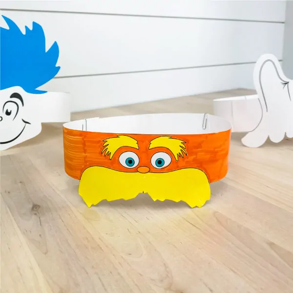 Colored in Lorax headband with Thing 1 and Horton headband in the background 