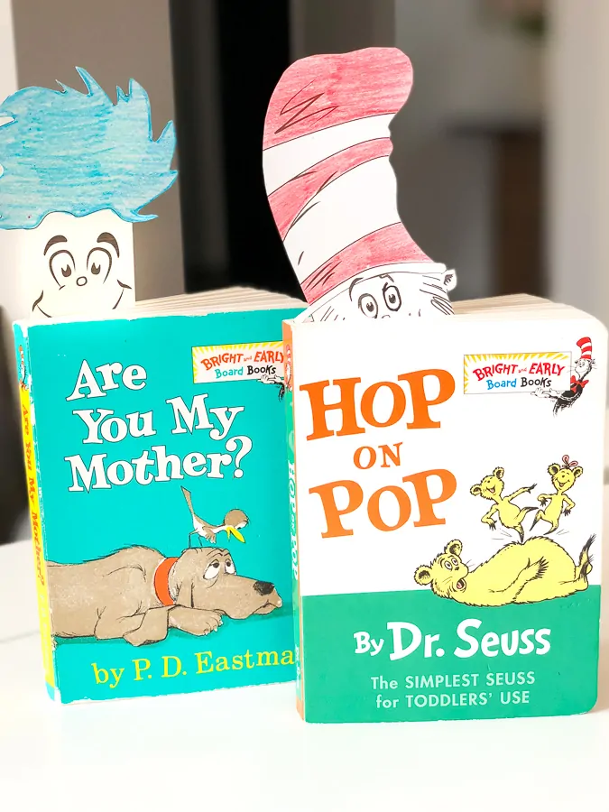 two dr seuss books with Thing 1 and The Cat in the Hat bookmarks