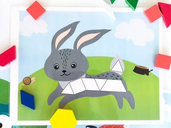 Bunny Pattern Block Mat | This bunny tangram mat is a perfect learning activity for kids. They work for preschool kids, kindergarten kids and pre-k children. Help teach math the fun way! #teachingmath #shapes #learningactivities #earlychildhood