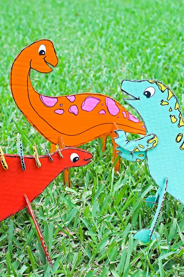Recycled Craft For Kids | Make these fun and easy cardboard dinosaurs for creative play! #earlychildhood #kidsandparenting #kidsactivities #dinosaurs #kids #childrenplay #outdoorplay 
