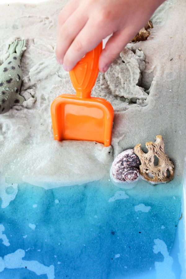 Beach Sensory Bin | Kids will have tons of fun playing with this ocean themed sensory table at home. #earlychildhood #preschool #sensoryplay #educationalactivities