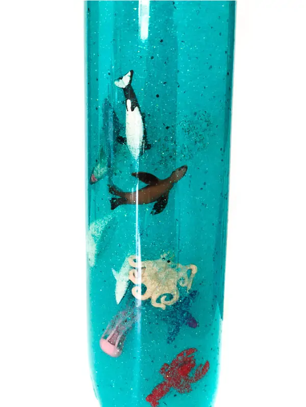 DIY Ocean Sensory Bottle | Make this simple ocean in a bottle with hair gel, glitter, ocean animals and water. #kidsactivities #childrenplay #kidsandparenting #ideasforkids