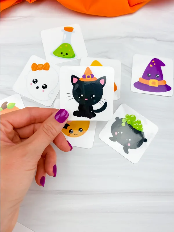 hand holding Halloween memory game card