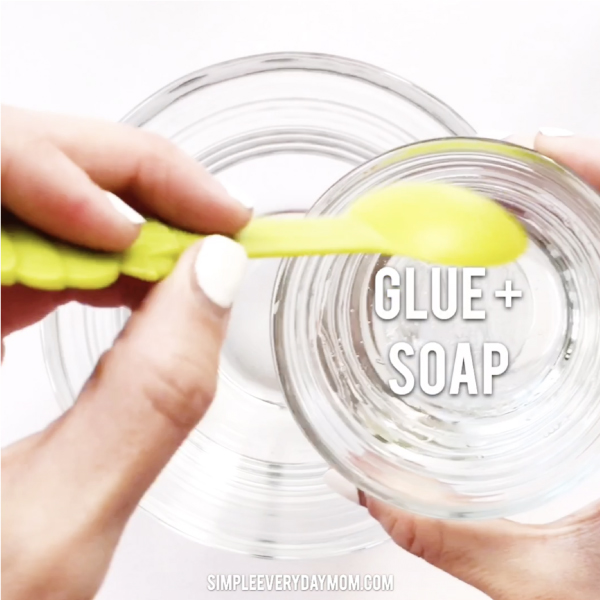 hand pouring glue and soap  into bowl 