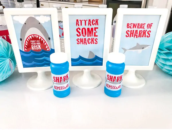 Shark Party Decorations For Kids | Throw an awesome DIY shark party with these cool 4x6 table signs. #sharks #kidsparties #sharkparty