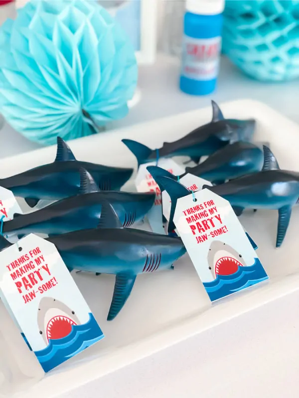 Shark Party Favor Ideas | Give a simple but fun favor with these plastic toy sharks. Add a printable tag and you're all set! #kidsparties #birthdayparty #kidspartyideas