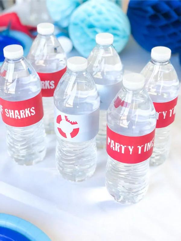 Shark Party Ideas | Transform plain water bottles into decorations with these printable shark themed water bottle labels. #party #printables #kidsparty #sharkparty