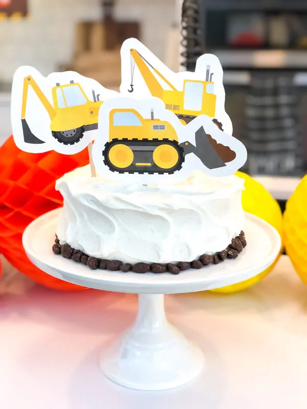 Boys Birthday Cake | Decorate a store bought cake with a these cake toppers and some raisenettes to make an easy and fun cake or smash cake for your little one. #cake #birthdaycake #boys #construction 
