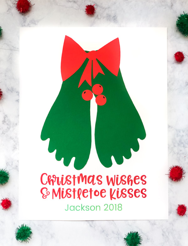 Christmas Footprint Craft | Kids will have a blast making this fun mistletoe keepsake. #earlychildhood #teaching #teacher #elementary #christmas #christmascrafts #handprintart #footprintart #baby 