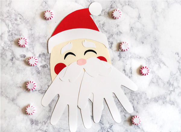 Kerstman van handafdruk en papier