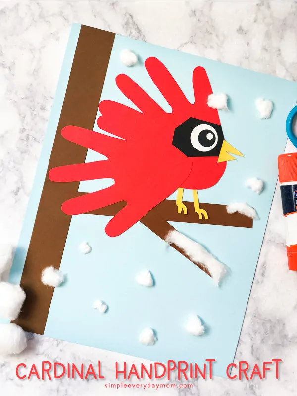 Cardinal Handprint Art | Make this cute winter scene with your child's handprint and a few supplies. #kidsactivities #winter #wintercrafts #craftsforkids