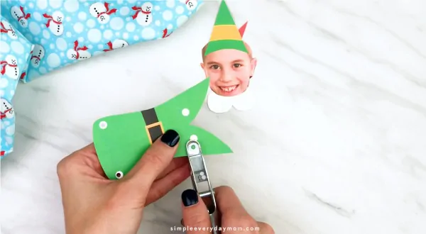 Hands punch holes from Buddy the elf photo craft 