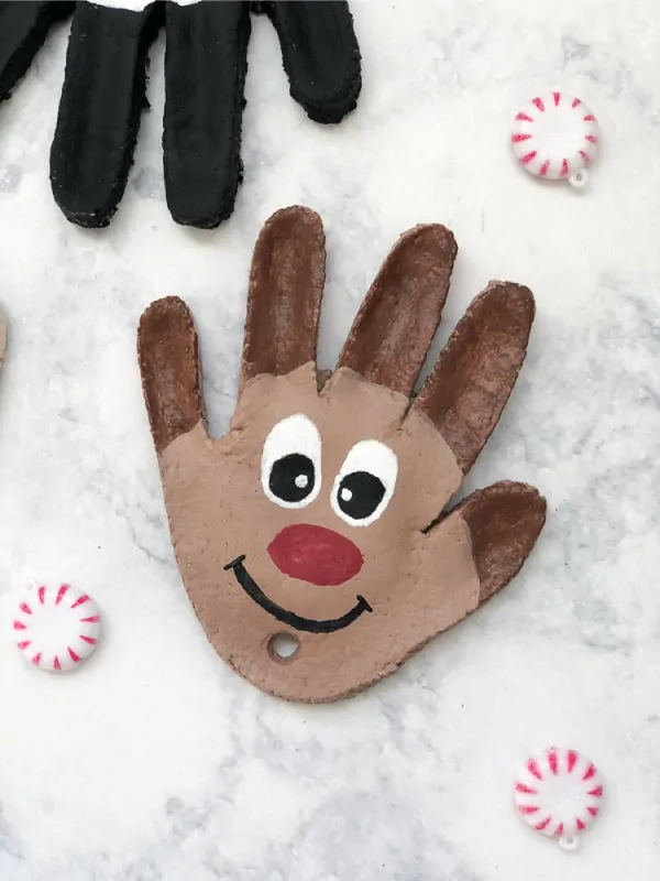 Christmas Salt Dough Ornaments | Make this reindeer handprint ornament this Christmas with just a few supplies. It's a fun Christmas craft for kids they'll love doing! #kids #kidsandparenting #kidscrafts #craftsforkids #kindergarten