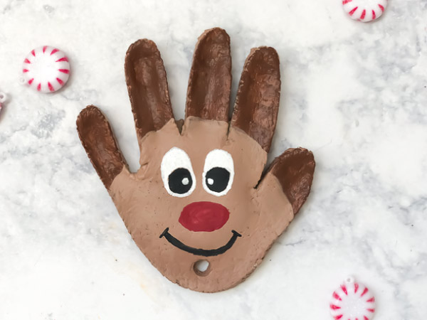 Salt Dough Christmas Ornaments For Kids | Make these cute Christmas ornaments with a few supplies. Find ideas to make snowmen, reindeer, an elf, and penguin. #christmascrafts #handprintcrafts #saltdough #earlychildhood #ideasforkids