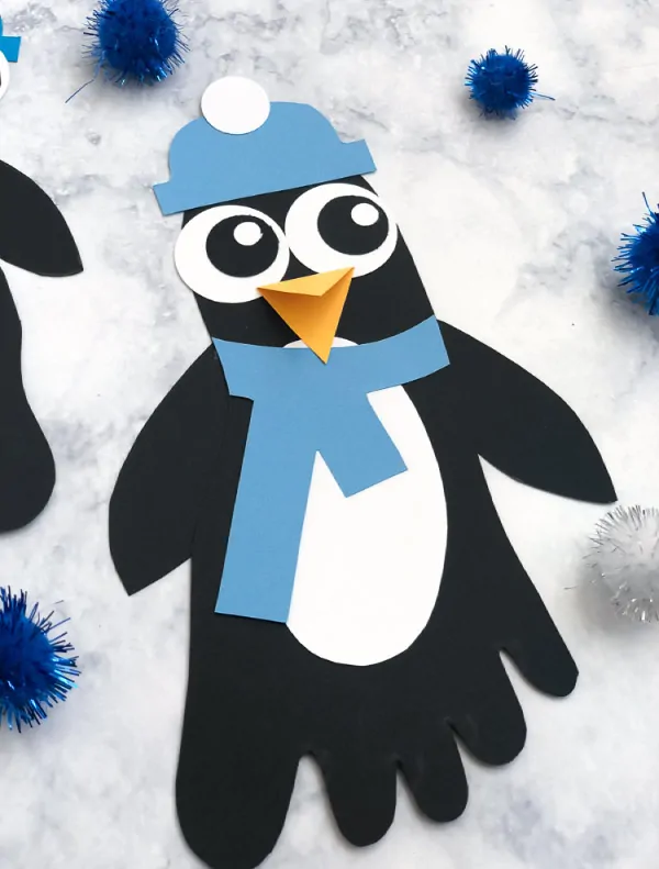Polar Animal Craft | Kids will have fun at home or in the classroom making these footprint penguin characters. #kids #teaching #teacher #homeschool #kidsactivities #activitiesforkids #children #kidscrafts
