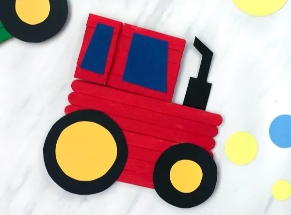 Farm Craft For Kids | Children will have fun making their own tractor art project made with popsicle sticks, paint, paper and wooden clothespins! #kids #kidscrafts #kidsandparenting #craftsforkids #tractorcraft #simpleeverydaymom #elementary