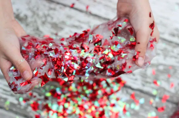 Easy Valentine Slime For Kids | Kids will have a blast playing with this confetti slime recipe that's so simple to make! All you need is some liquid starch, clear glue and confetti! #slime #sensory #sensoryplay #valentines #valentinesday #craftsforkids #kidscrafts #kidsactivities #activitiesforkids #slimerecipe #howtomakeslime #slimeforkids 