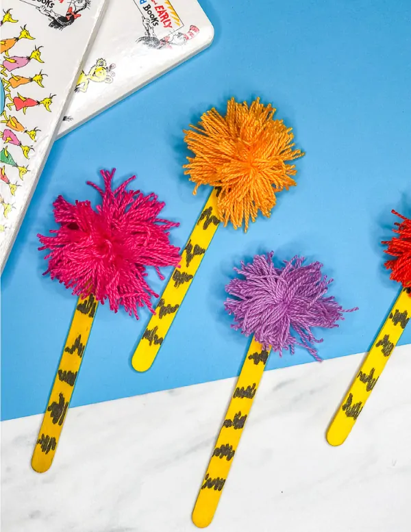 Dr Seuss Craft For Kids | Make this easy popsicle stick truffula tree craft. It's perfect to do at home or in the classroom. #preschool #elementary #kindergarten #teachers #kids #toddlers #kidsactivities #kidscrafts #craftforkids #ideasforkids #drseuss #drseusscrafts #drseussactivities