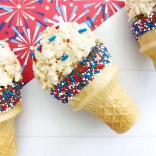 4th Of July Dessert Idea | This Independence Day, make these cute rice krispie treat faux ice cream cones the kids will love. You don't have to worry about them melting and they're easy and patriotic! #kids #kidsandparenting #patriotic #4thofjuly #fourthofjuly #dessertideas #ricekrispietreats #4thofjulydesserts #dessertsforkids #nobakedesserts #easydesserts #easydessertideas