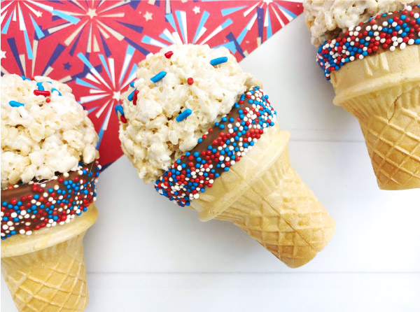 4th Of July Dessert Idea | This Independence Day, make these cute rice krispie treat faux ice cream cones the kids will love. You don't have to worry about them melting and they're easy and patriotic! #kids #kidsandparenting #patriotic #4thofjuly #fourthofjuly #dessertideas #ricekrispietreats #4thofjulydesserts #dessertsforkids #nobakedesserts #easydesserts #easydessertideas
