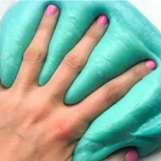 hand pressed into fluffy slime