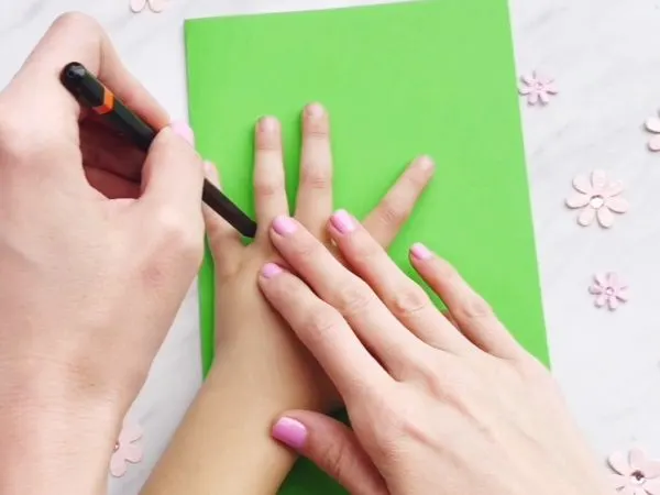 Tracing the hand of Handprint Cactus Mother's Day Card Craft
