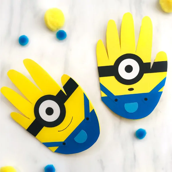 Handprint Minion Craft For Kids | Make this DIY minion card for Dad this Father's Day or any celebration! #kids #kidsactivities #kidsactivity #kidscrafts #craftsforkids #handprintcrafts #handprintart #minion #minioncrafts #fathersday #preschool #kindergarten #elementary #ece #earlychildhood