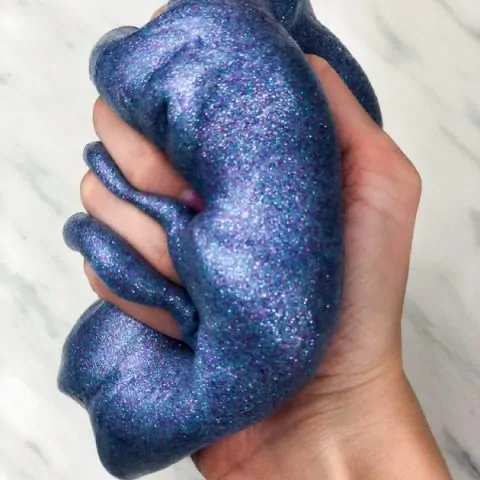 hand squeezing galaxy slime