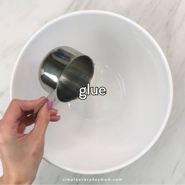 clear glue being poured into white bowl