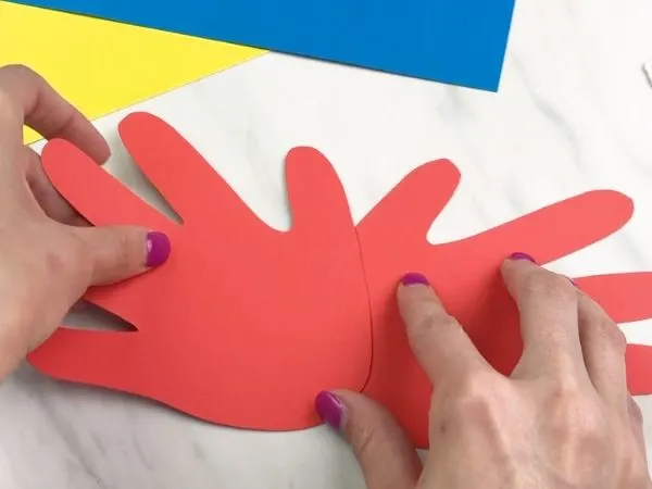 gluing two cut out traces of hand together