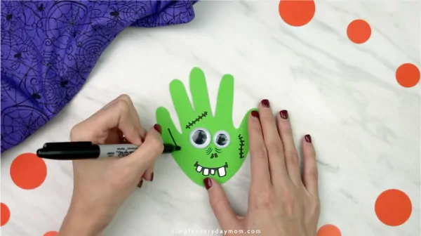 handprint-zombie-craft-for-kids-halloween-craft-video-8.jpg.webp