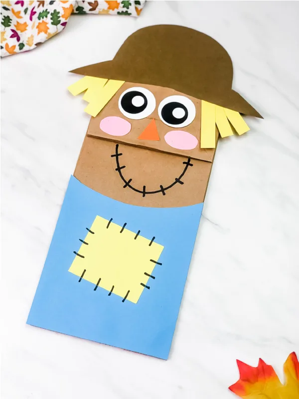 paper bag scarecrow craft image collage with the words paper bag scarecrow craft for kids