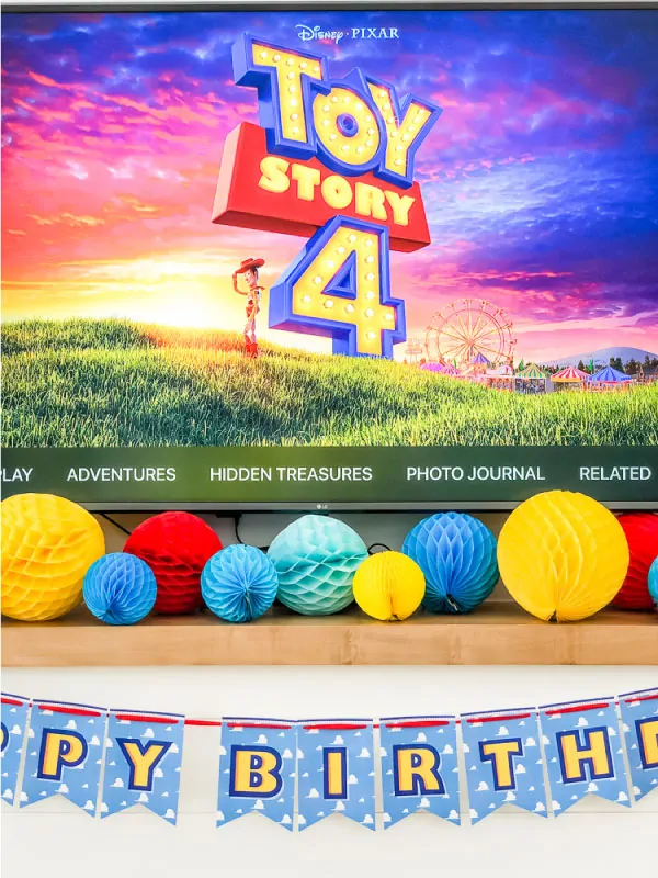 Closeup of Toy Story 4 party decorations on fireplace 