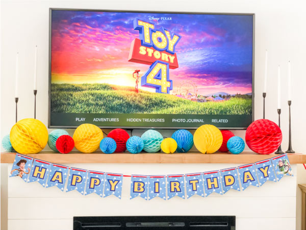 Toy Story 4 party decorations on fireplace
