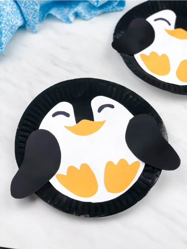 Closeup of paper plate penguin craft 