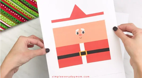Hands holding toilet paper roll Santa craft template 