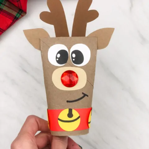 hand holding toilet paper roll reindeer craft