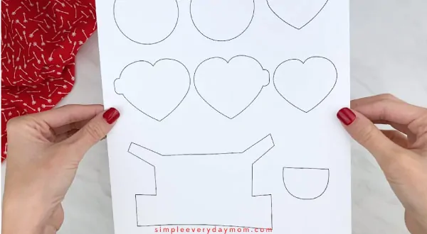 Hands holding valentine minion craft template