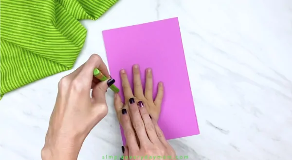 adult hand tracing child hand