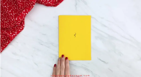 Hands on yellow paper 