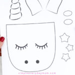 hands holding unicorn craft template
