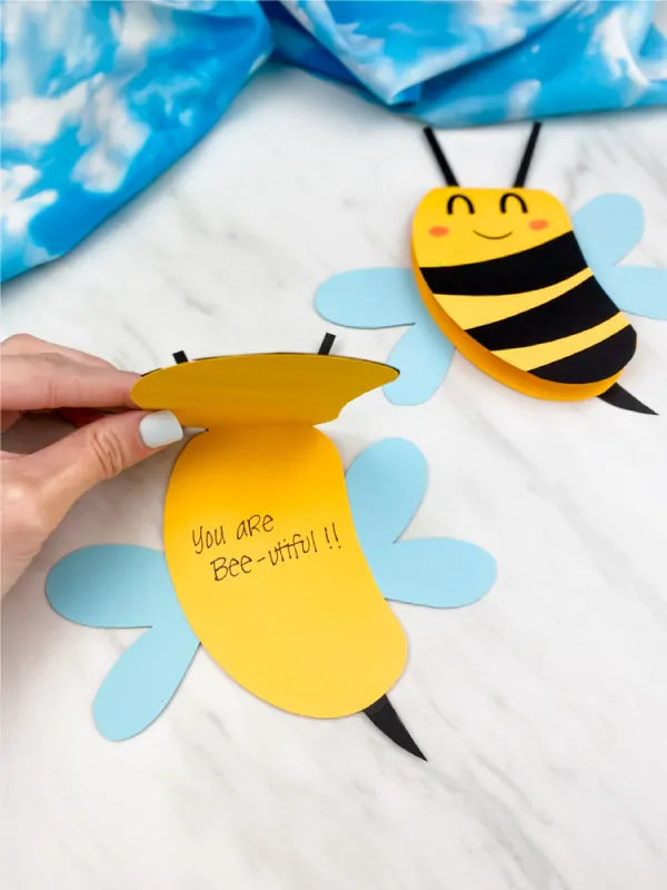 Hand opening paper bee card craft 