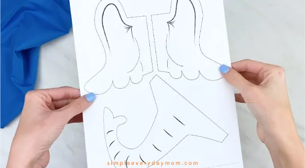 Hands holding Horton paper bag craft template 